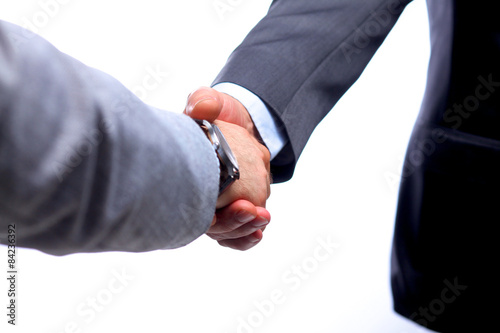 Closeup of a business handshake, on white background