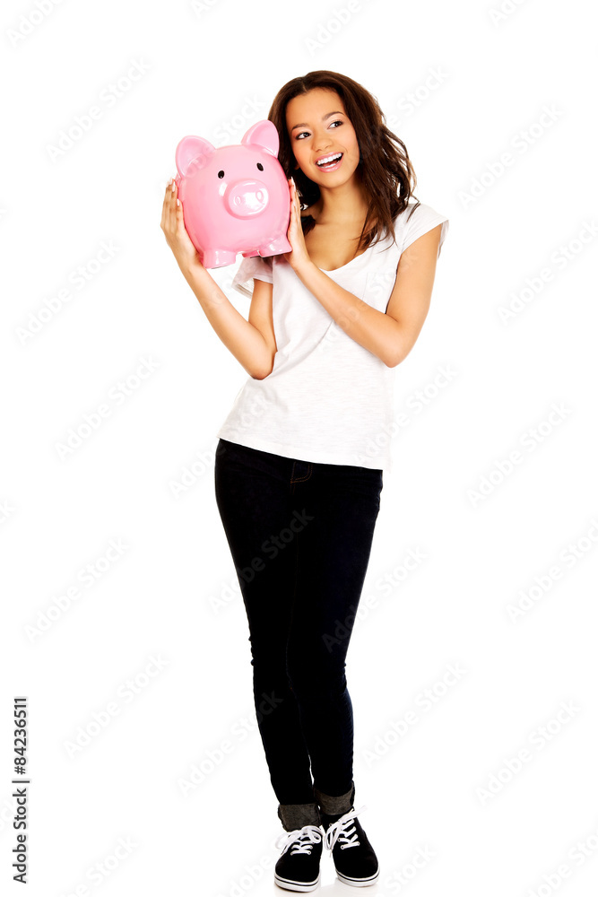 African woman with piggybank. African woman with piggybank.