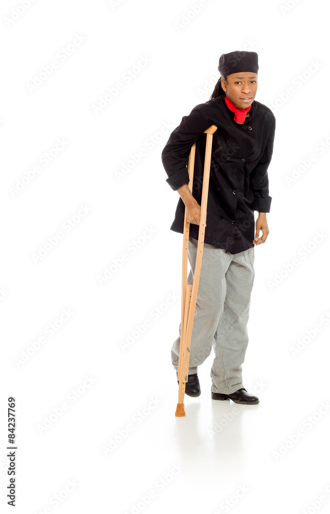 Model shot in studio on white injured with crutch Model shot in studio on white injured with crutch