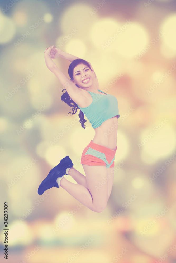 Female trainer workout over blur background