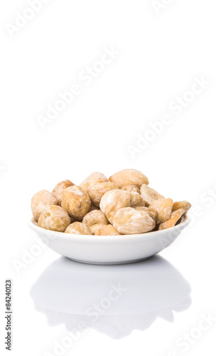 Candlenuts over white background