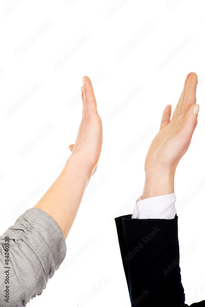 Two businesswomen giving a high five. Two businesswomen giving a high five.