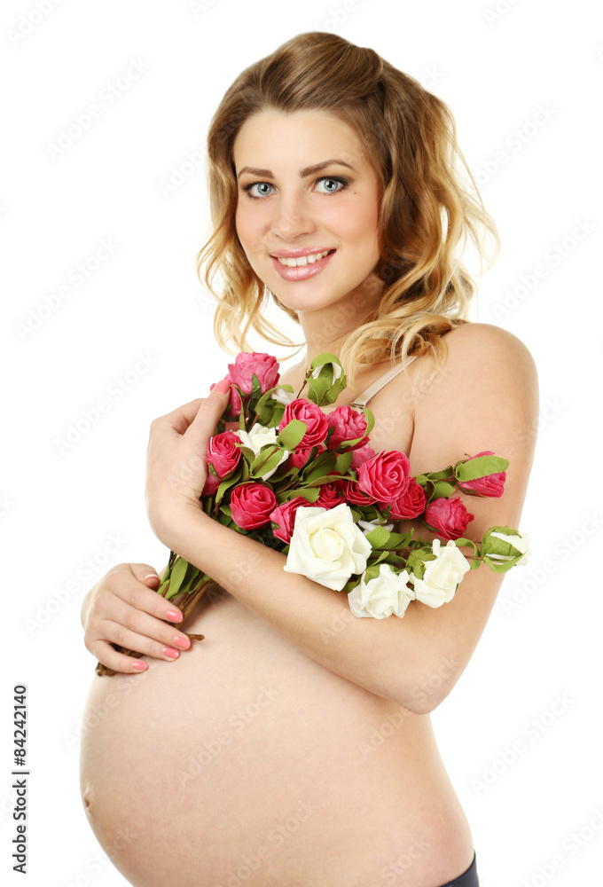 Beautiful pregnant woman with flowers on white background