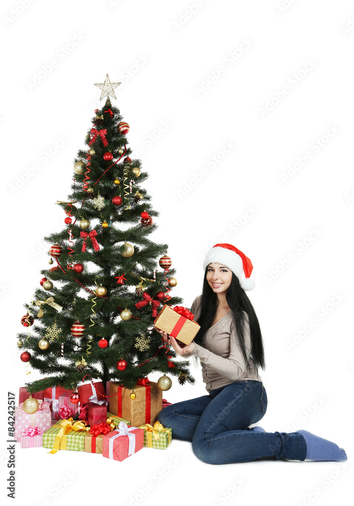 Young beautiful woman with christmas tree on white background