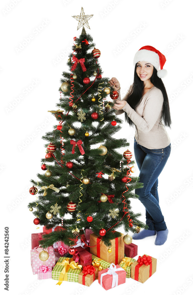 Young beautiful woman with christmas tree on white background