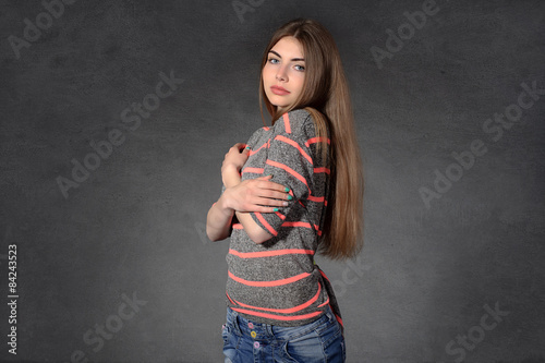 Canvas Print Girl shows modesty or timidity against a dark background