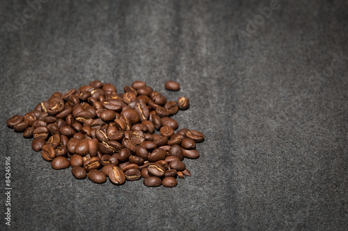 Pile of coffee beans on stone counter