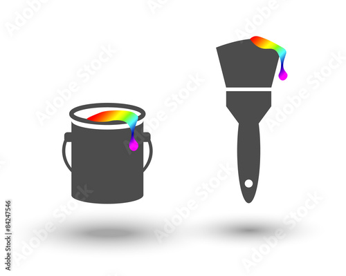Paint bucket and brush with colourful paint drop