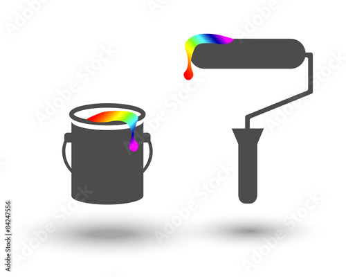 Paint bucket and roller with colourful paint drop