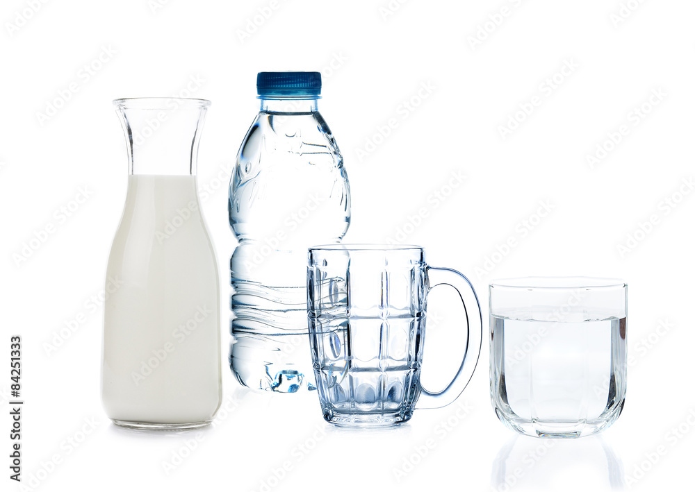 bottle of drinking water , milk and glass of water on white back bottle of drinking water , milk and glass of water on white back