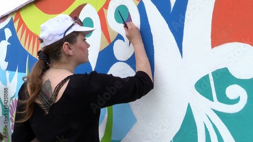 Girl drawing on the wall,mural art.