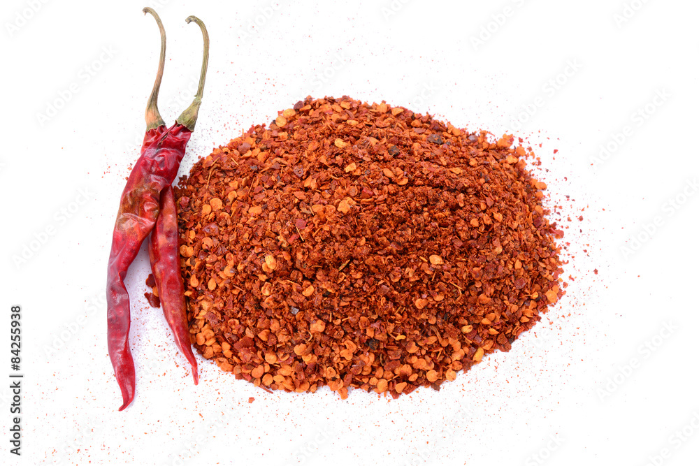Crushed Red Chili Pepper flakes isolated on white background Crushed Red Chili Pepper flakes isolated on white background