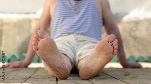 Men's legs, feet on the hardwood