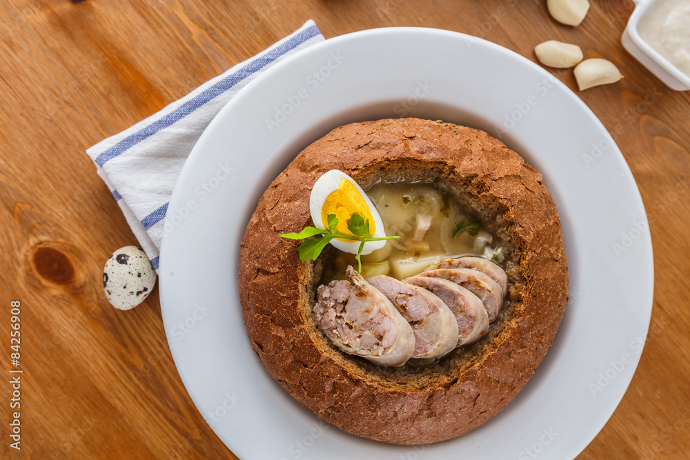 Traditional polish zurek with sausage, egg in bread Traditional polish zurek with sausage, egg in bread