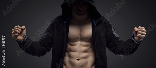 Portrait of a hooded muscular athlete