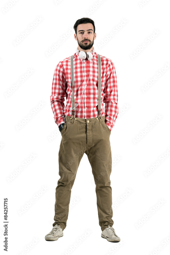 Bearded young dj in retro clothes with headphones around neck Bearded young dj in retro clothes with headphones around neck