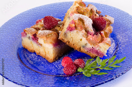 Fresh rhubarb cake with raspberries and decorations