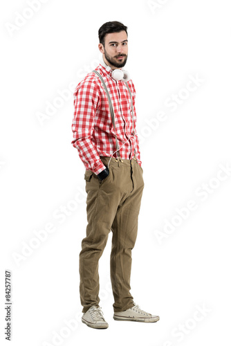 Young hipster dj posing with headphones isolated