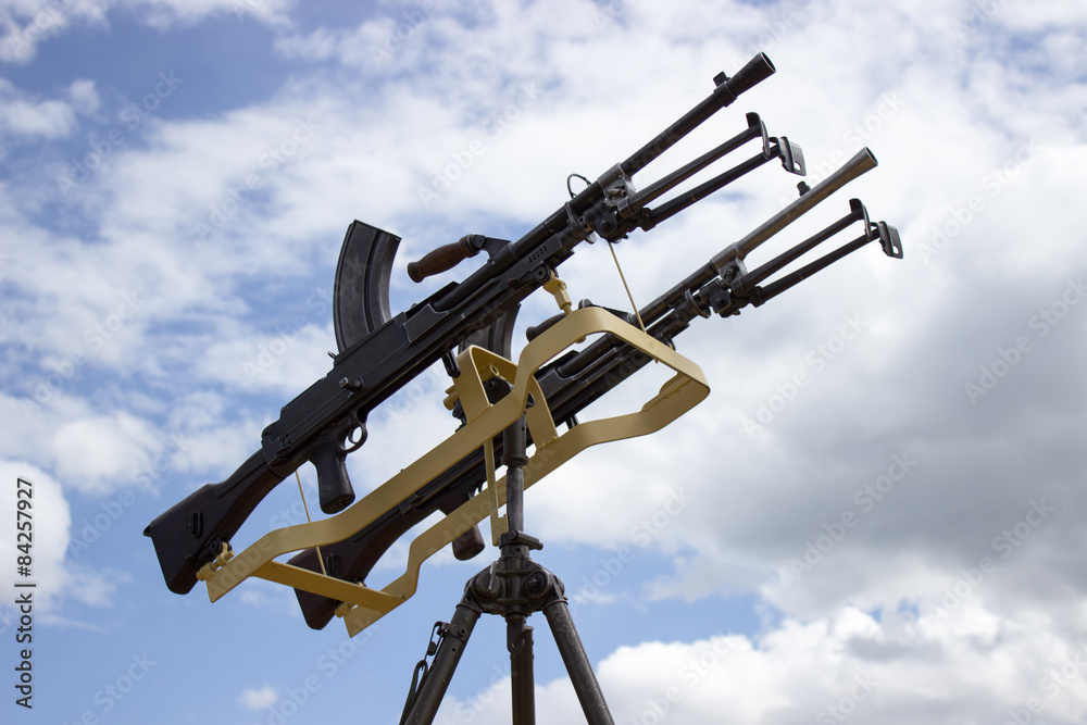 machine gun on a stand against the sky machine gun on a stand against the sky