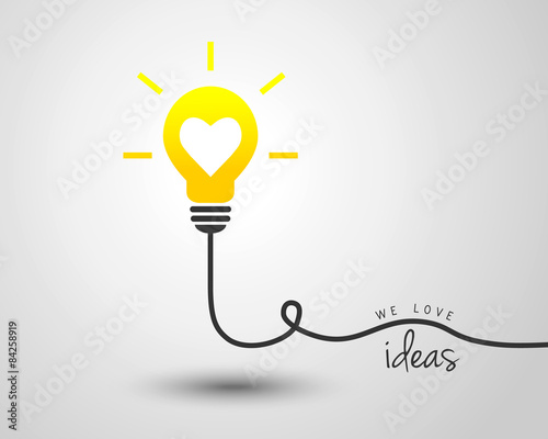 Shining light bulb with heart as idea and motivation concept