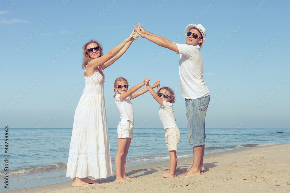 Happy family walking on the beach at the day time. Happy family walking on the beach at the day time.