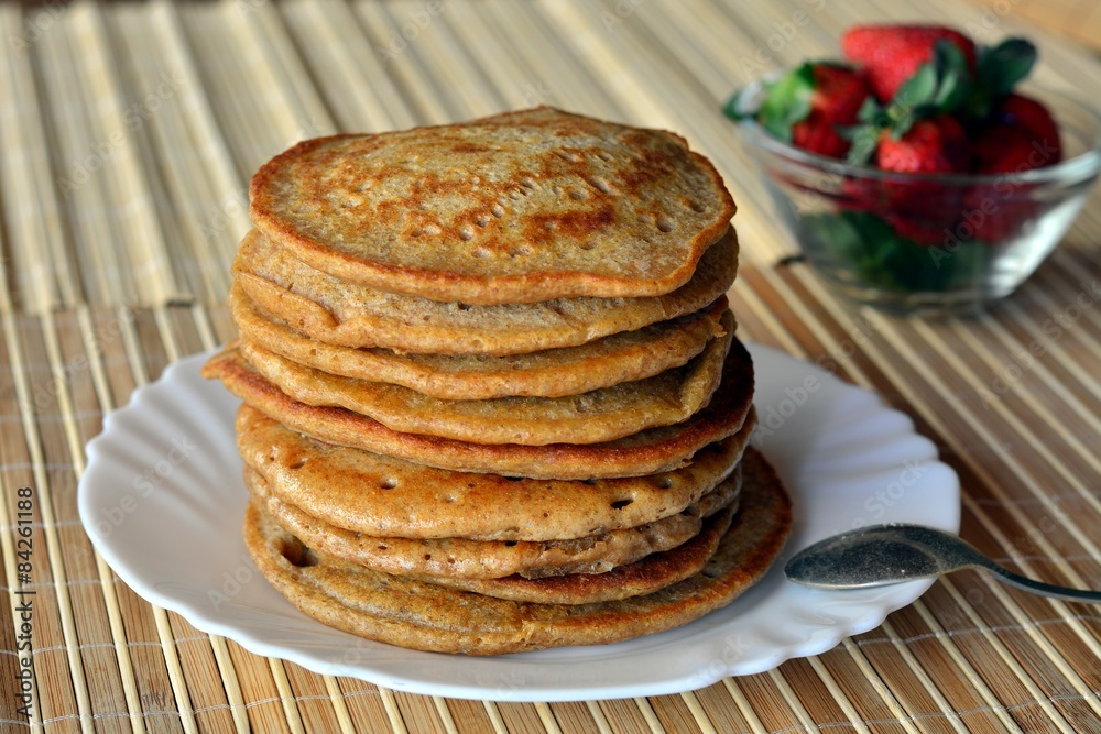 Stack of sweet pancakes with strawberries
