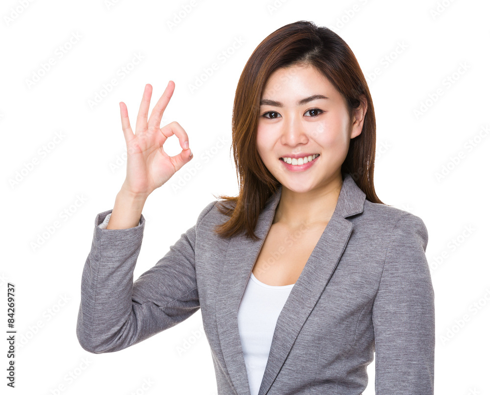 Asian businesswoman with ok sign gesture Asian businesswoman with ok sign gesture