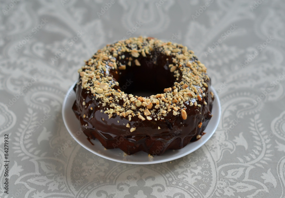chocolate cake with chocolate frosting and nuts chocolate cake with chocolate frosting and nuts