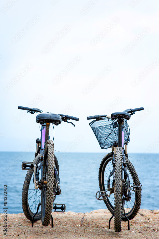 Fototapeta premium Two bicycles on the pier