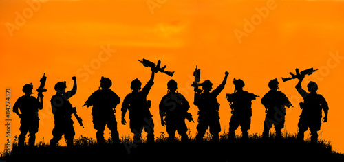 Silhouette of military team soldiers or officers with weapons