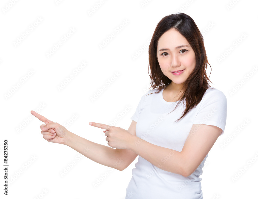 Asian student with two finger point aside