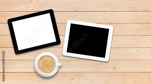 Two tablet PCs and coffee on a wooden table