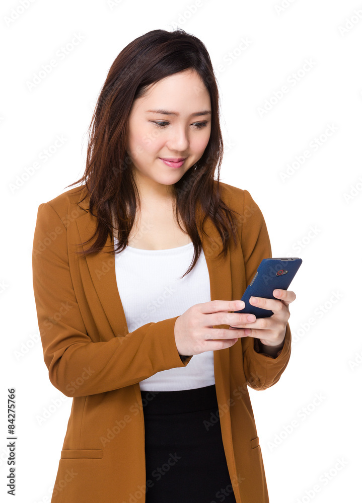 Businesswoman read the message on mobile phone Businesswoman read the message on mobile phone