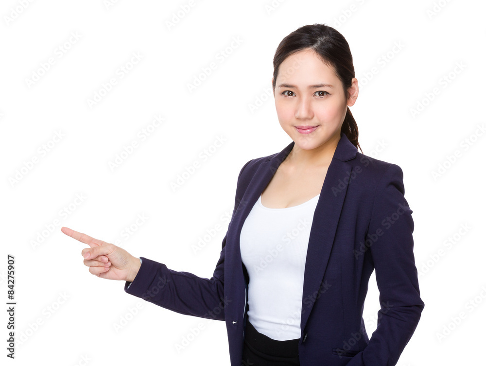 Young businesswoman with finger point aside Young businesswoman with finger point aside