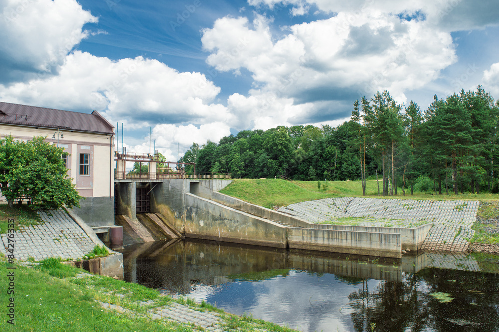 Village hidroelectric dam with forest and river