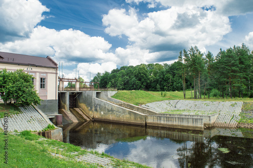 Village hidroelectric dam with forest and river