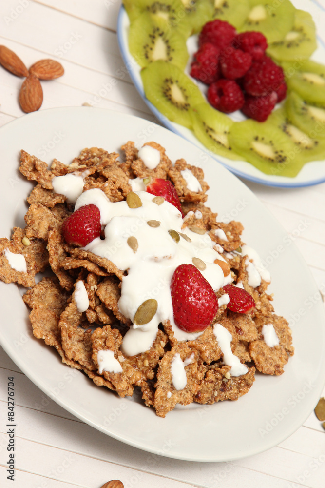 Fototapeta premium Healthy meal with fruits, cereals and nuts