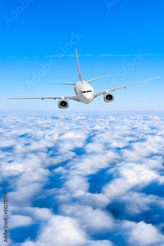airplane in the sky. Passenger jet air plane flying on blue sky