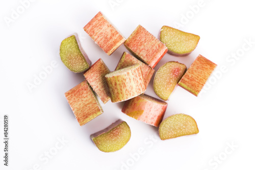 chopped red rhubarb on white background