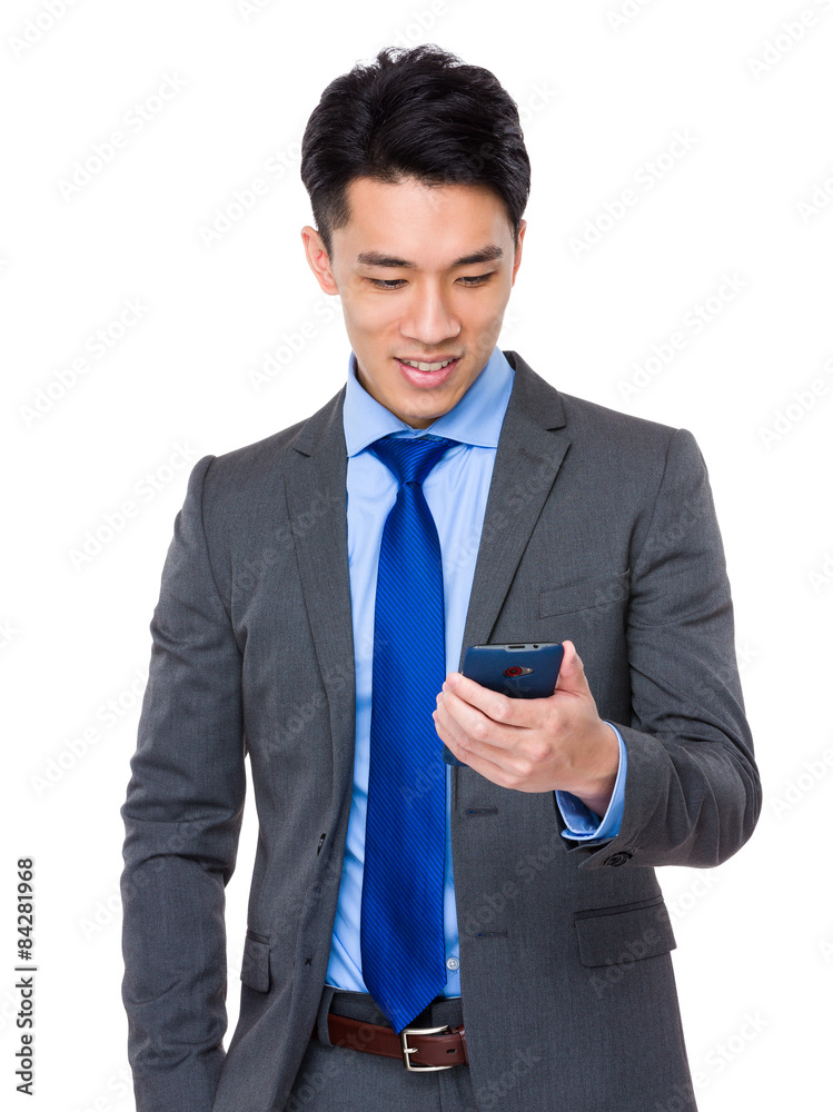 Businessman read the message on smart phone Businessman read the message on smart phone