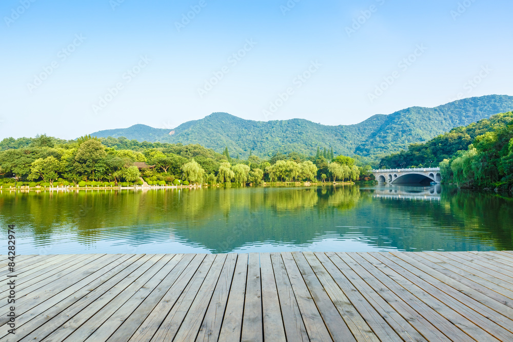 platform beside lake with morning in park