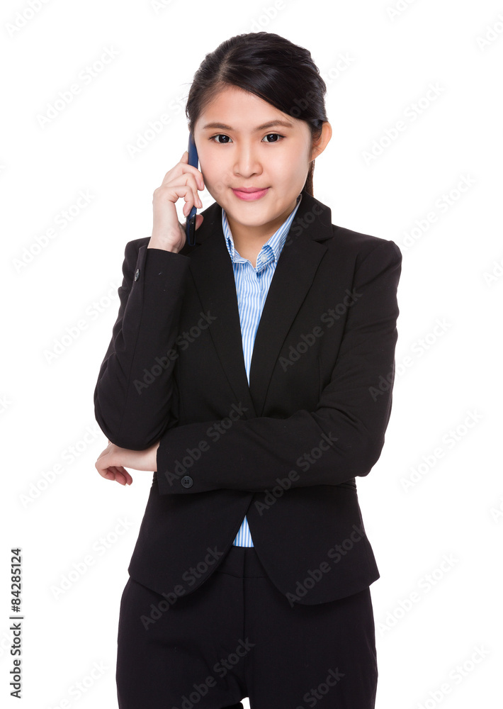 Asian businesswoman talk to cellphone Asian businesswoman talk to cellphone