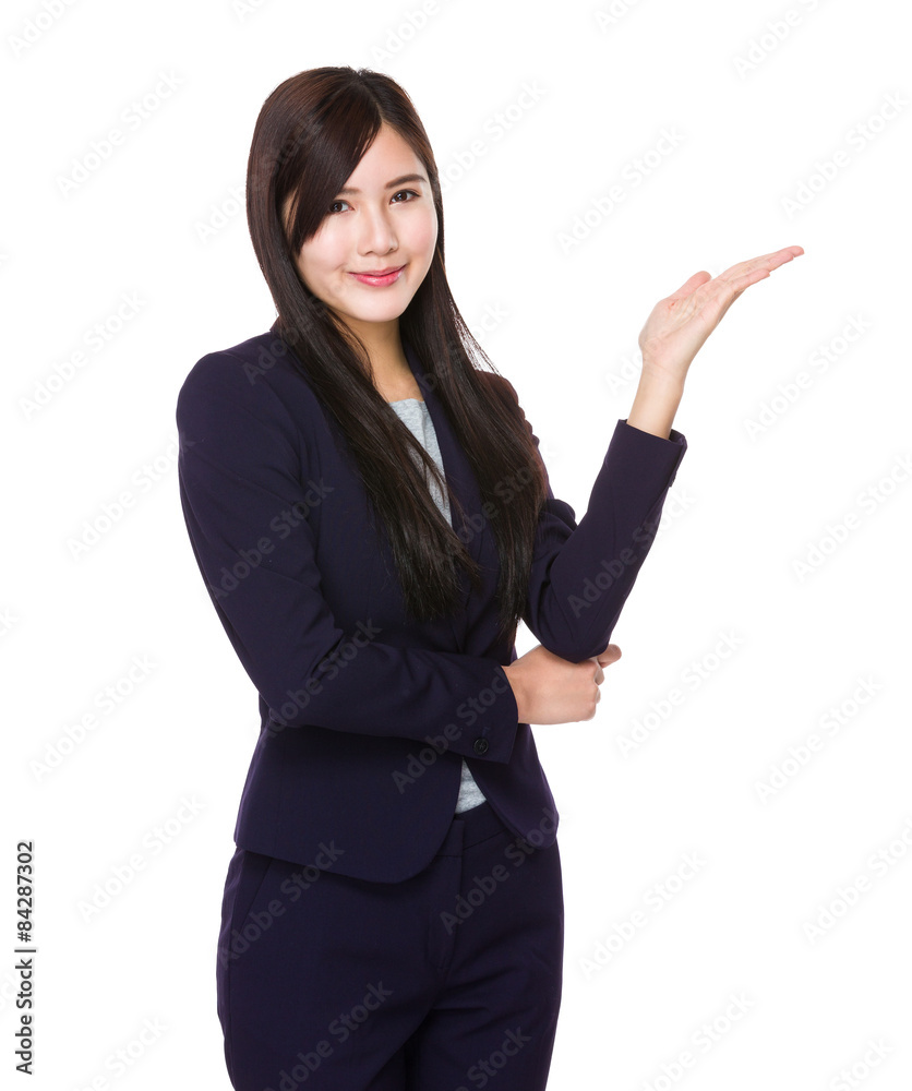Young businesswoman with hand showing something Young businesswoman with hand showing something