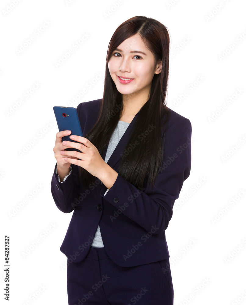 Businesswoman use of cellphone Businesswoman use of cellphone