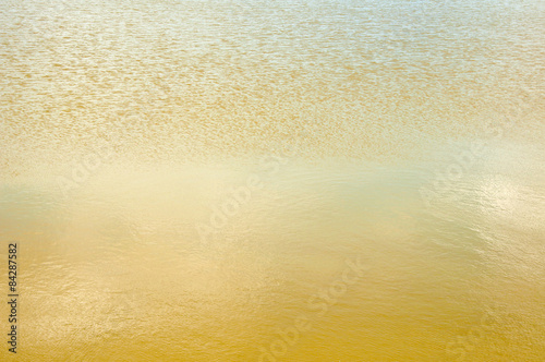 golden water texture background close up