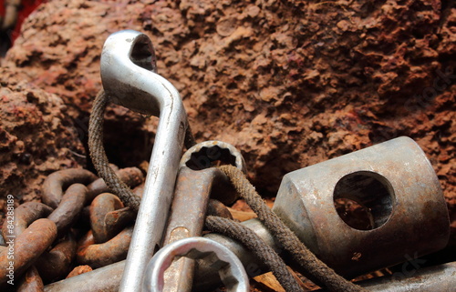 Naklejka rusty tool lay down in the rock background