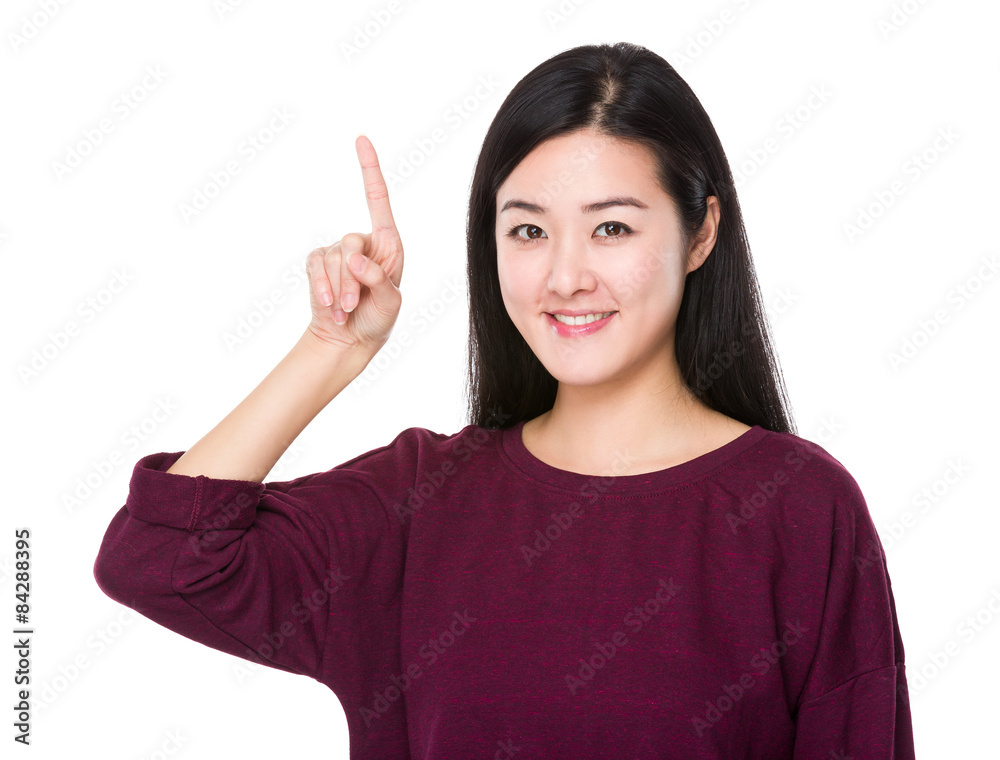 Beautiful woman with finger pointing upwards Beautiful woman with finger pointing upwards
