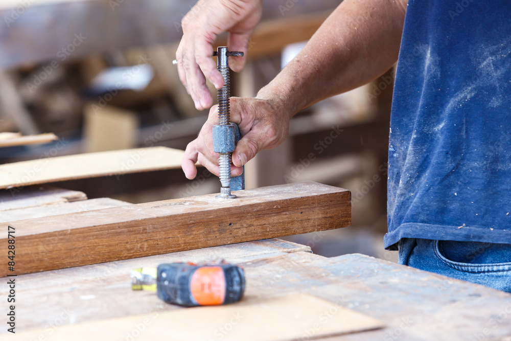 carpenter use saw cut wood for make new furniture carpenter use saw cut wood for make new furniture