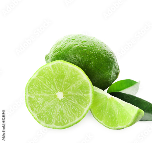 Sliced fresh limes isolated on white