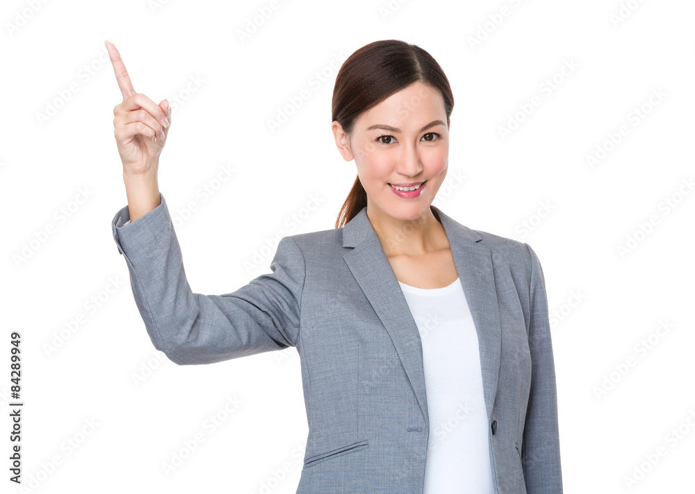 Businesswoman with finger pointing up Businesswoman with finger pointing up